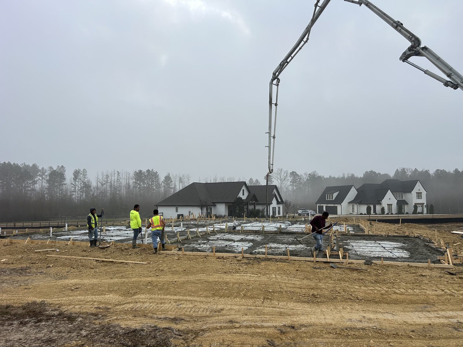 J.V. Construction crew pouring a foundation slab in Central Mississippi